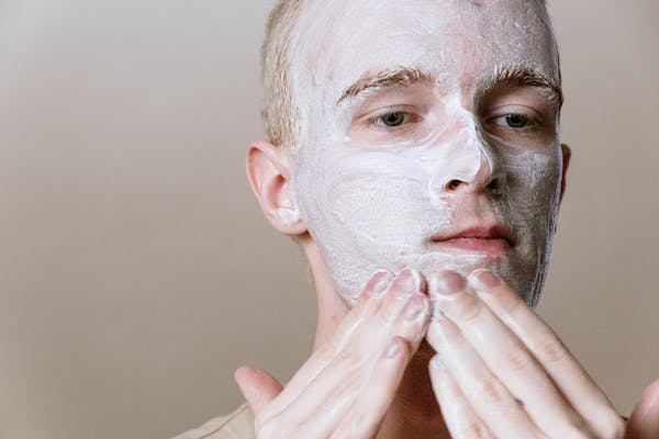 Man applying cream 