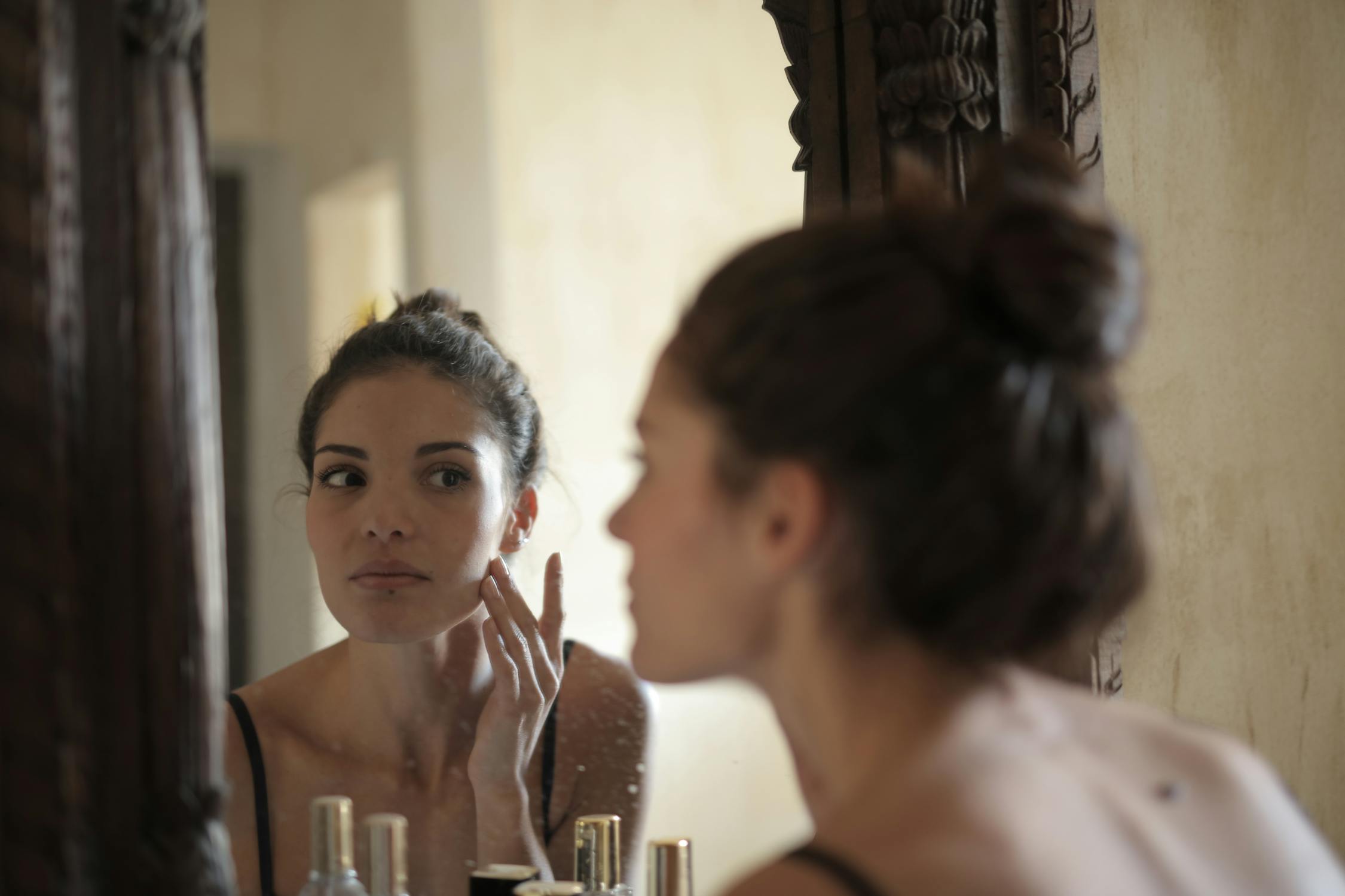 Woman looking in mirror 